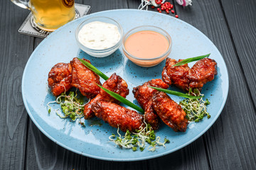 Baked chicken wings in the Asian style on plate