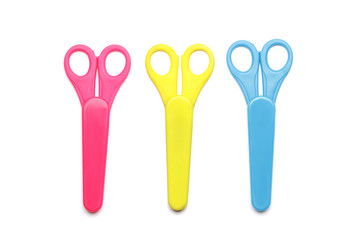 set of different color scissors isolated on a white background.