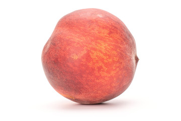 Group of two whole fresh fuzzy peach on wooden square plate isolated on white background
