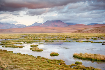 Volcanos, lagunas and desert of Atacama Desert. Mountains southern and northern from San Pedro de Atacama. Stunning scenery in sunlight at Atacama desert, Chile, South America