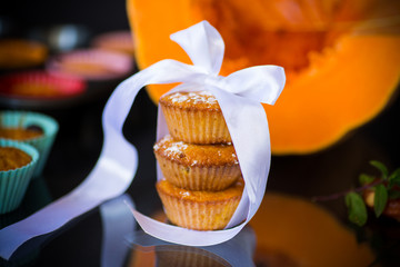 baked sweet pumpkin muffins with dried apricots inside