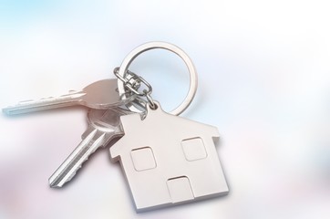 House keys with house figure  on background