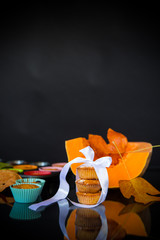 baked sweet pumpkin muffins with dried apricots inside