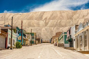 Chacabuco Ghost Town from the Saltpeter Mining Era near Chuquicamata, world`s biggest open pit copper mine, Calama, Chile. Mining Operations at open pit Copper Mine near Calama, Northern Chile.