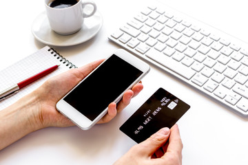 credit card, keyboard, smartphone and coffee cup on white background
