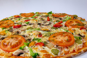 Vegetarian pizza closeup background with mushrooms, bell pepper, gherkin and tomatoes