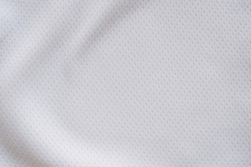 Plakat White fabric sport clothing football jersey with air mesh texture background