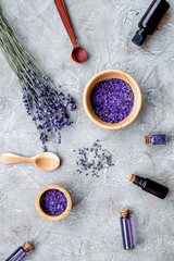 Fototapeta na wymiar Essential oil and lavender salt with flowers top view
