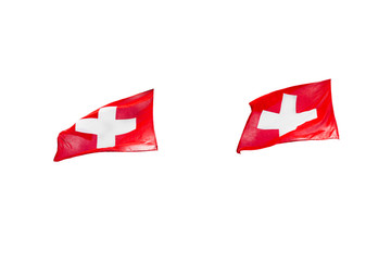 Two Swiss flags waving in the wind on the left, isolated on white background with clipping path.