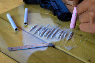 Cocaine ready for uses on wooden table. Cocaine Drug Addiction Concept