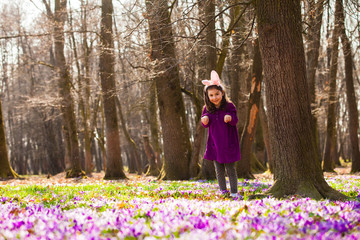 Fototapeta premium Little girl with banny ears in spring park