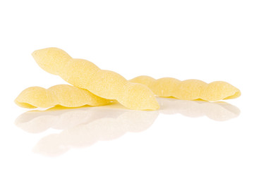 Group of three whole uncooked pasta cavatelli isolated on white background