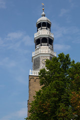 Fototapeta na wymiar Monumental tower of church in historic Dutch city Hindeloopen