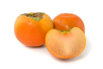 Fresh ripe persimmons isolated on white background with clipping path
