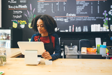 Barista looking at monitor