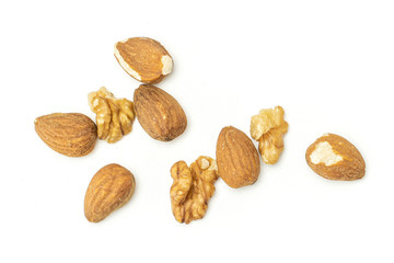 Group of nine whole brown almond nut isolated on white background