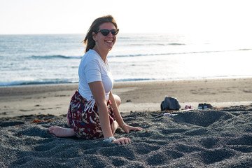 woman sitting on the beach