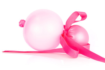 One whole pink latex pastel ballon with pink ribbon isolated on white background