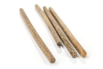 Group of two whole asian brown chopsticks isolated on white background