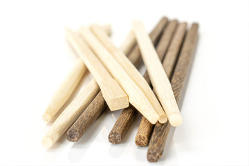 Lot of whole asian brown chopsticks stack isolated on white background