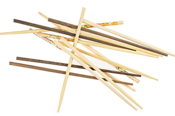 Lot of whole crossed asian brown chopsticks flatlay isolated on white background