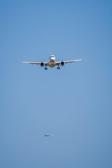 Fototapeta na wymiar Passenger airplane in the blue sky