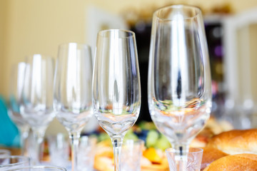 Banquet table served with instruments and decorated with wine glasses