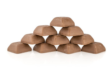 Lot of whole dark fresh chocolate piece heap isolated on white background