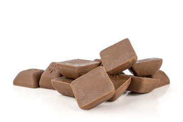 Lot of whole dark fresh chocolate piece heap isolated on white background