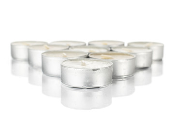 Lot of whole waxy white tea candle delta isolated on white background