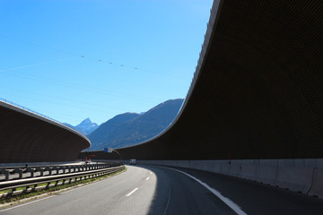 aerial view of the highway in the mountains from car window, Austria