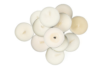 Lot of whole waxy white tea candle flatlay isolated on white background