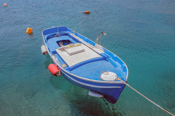 Moored boat in the port of Kokkari in Samos, Greece.