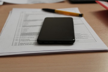 tablet and pen on table