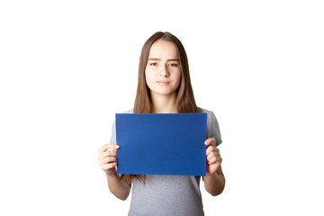 Young european girl with long dark hair holding a blue sheet of copyspace