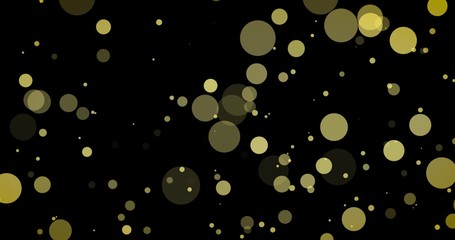 Golden confetti and bokeh lights on the black Merry Christmas background.