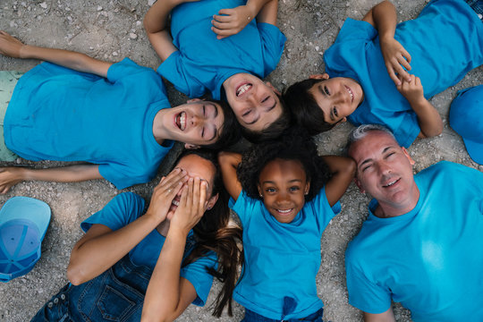 Group of people happy lying on the ground