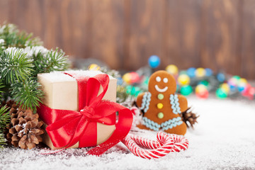 Christmas gift box, candy canes and gingerbread man
