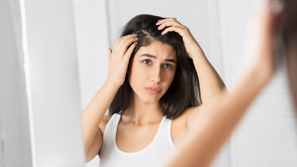 Girl Looking At Hair Flakes In Mirror Standing In Bathroom, Panorama - obrazy, fototapety, plakaty