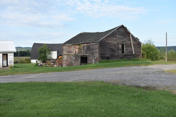 Scenic mountainous area in Central New York State, with an old abandoned structure on the land