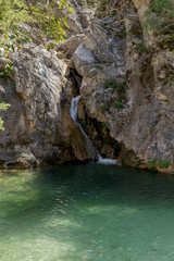 Fototapeta na wymiar The mountain river Elikonas on a sunny day (Greece, Pieria, Mount Olympus).