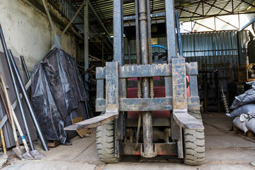 Old forklift in a garage.