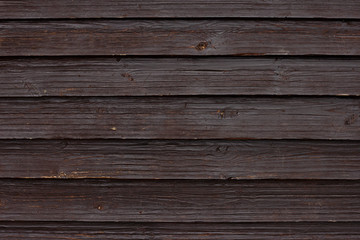 Fototapeta premium Old wooden wall painted in dark color