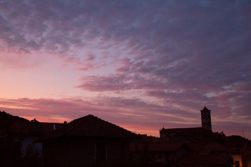 Naklejka na ściany i meble Sunset over rooftops