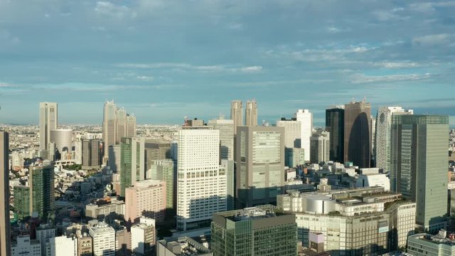 day flying backwards from Shinjuku Tokyo revealing NTT Docomo Yoyogi Building
