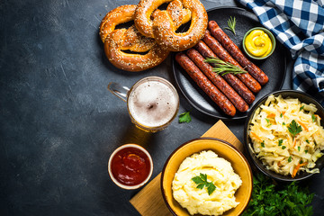 Oktoberfest food - sausage, beer and bretzel.