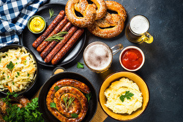 Oktoberfest food - sausage, beer and bretzel.