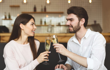 Happy young couple congratulating each other with anniversary