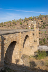 Fototapeta na wymiar The Roman bridge of Alcantara is a two thousand year old stone bridge that crosses the Tagus River. Built by the Romans to connect an important commercial route.