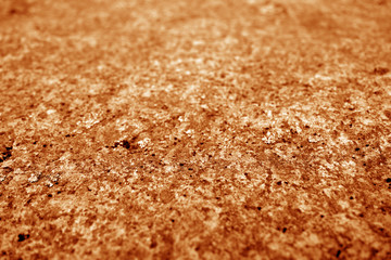 Marble stone background with blur effect in orange tone.